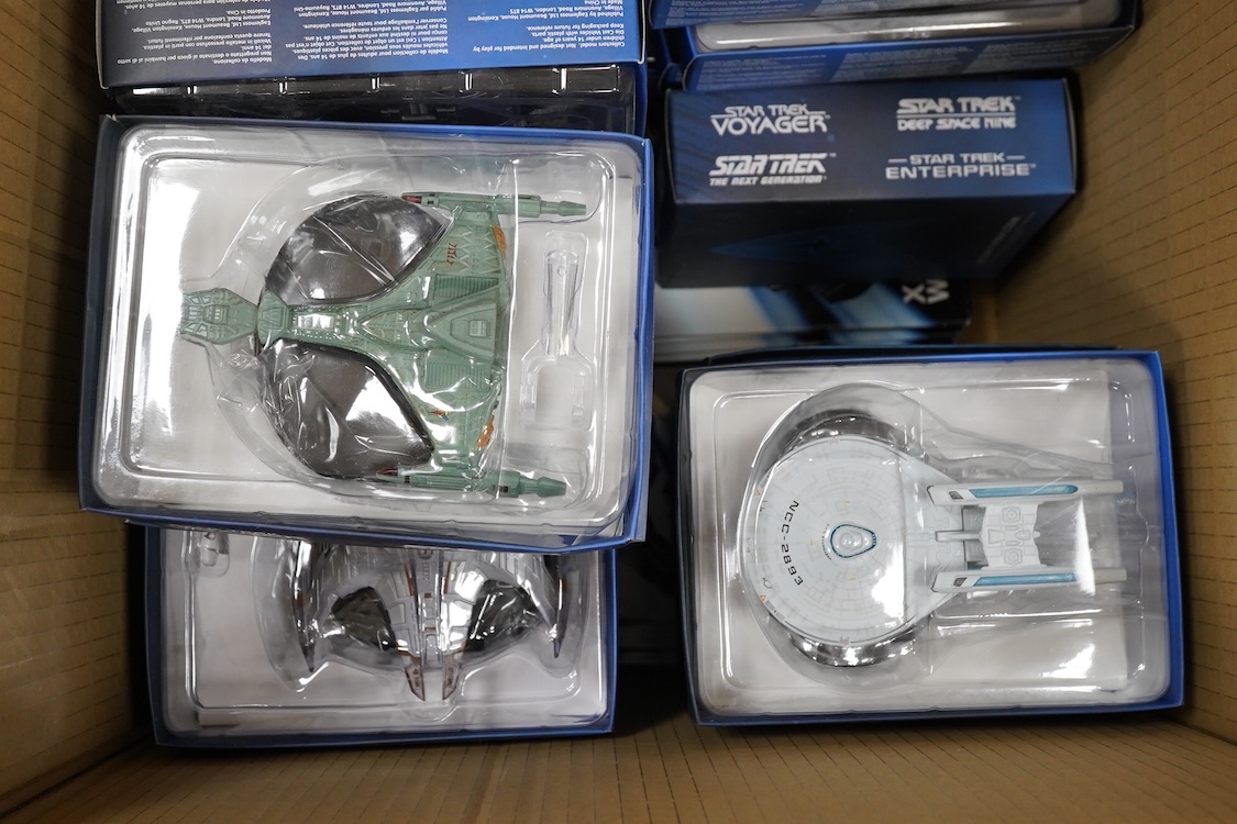 Twenty-five boxed Star Trek Eaglemoss Collections magazine issue starship models, with the associated magazines (unchecked)